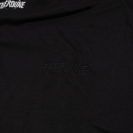 Close-up of a black T-shirt with tonal black embroidered 'Therdune' text on the chest.