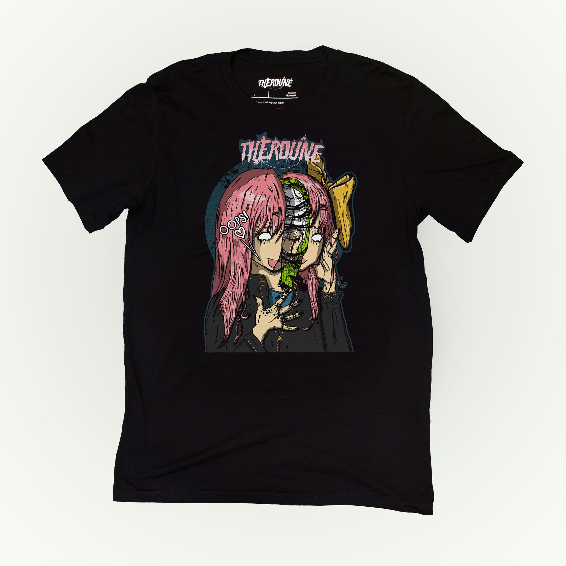 Black shirt with an anime face splitting in half with a crying person inside. flat lay on white background.
