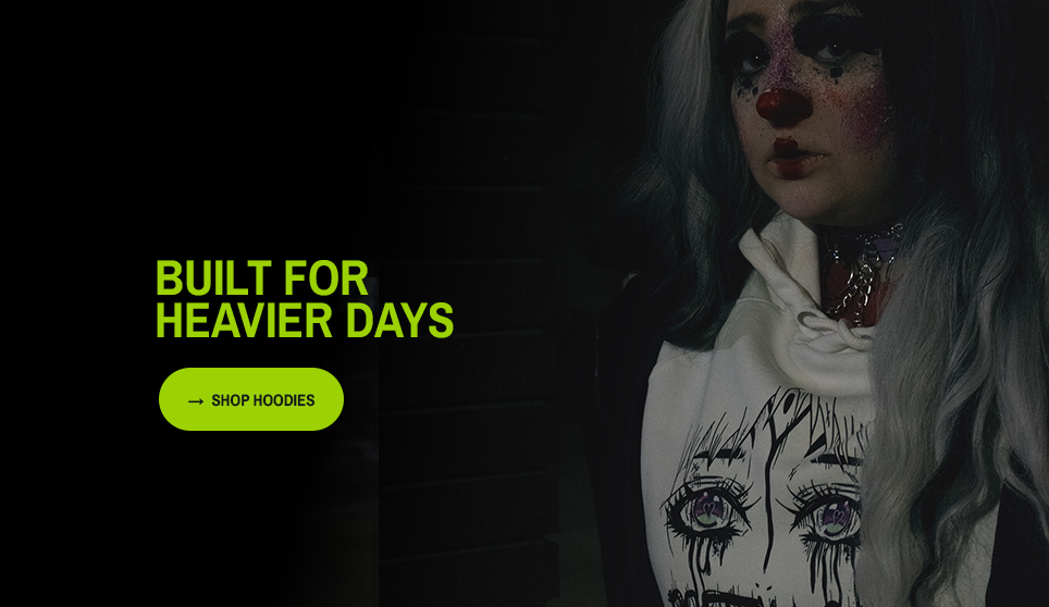 Person wearing a hoodie with artistic design, text 'Built for Heavier Days' on a dark background. A button is present that states "shop hoodies" 