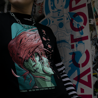 Black shirt with a woman underwater with pink hair. Text that says "Did you take everything you need? - Therdune". worn by a model in an urban setting.