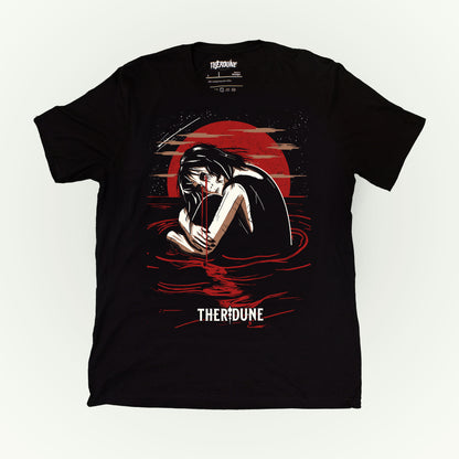 Black shirt with a graphic of a woman crying in knee high water with a red moon in the background. Flat lay on white background.