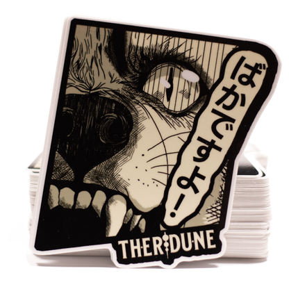 black and white manga style wolf, japanese characters that say "bakadesuyo" and an english Therdune logo.