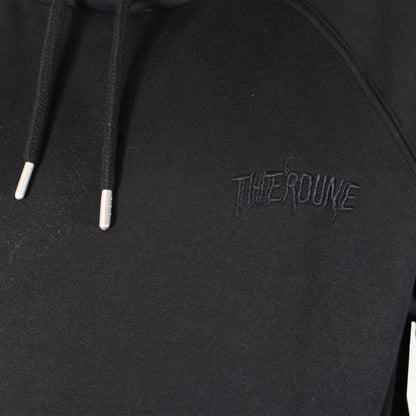 Close-up of a black pullover hoodie with black drawstrings and a tonal black embroidered logo reading 'Therdune' on the chest.