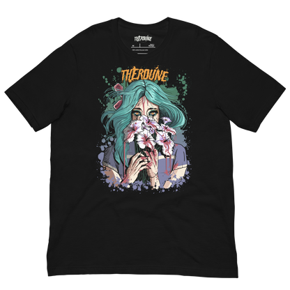 Black shirt with a stylized illustration of a person with teal hair and colorful makeup. Flat lay on transparent background.